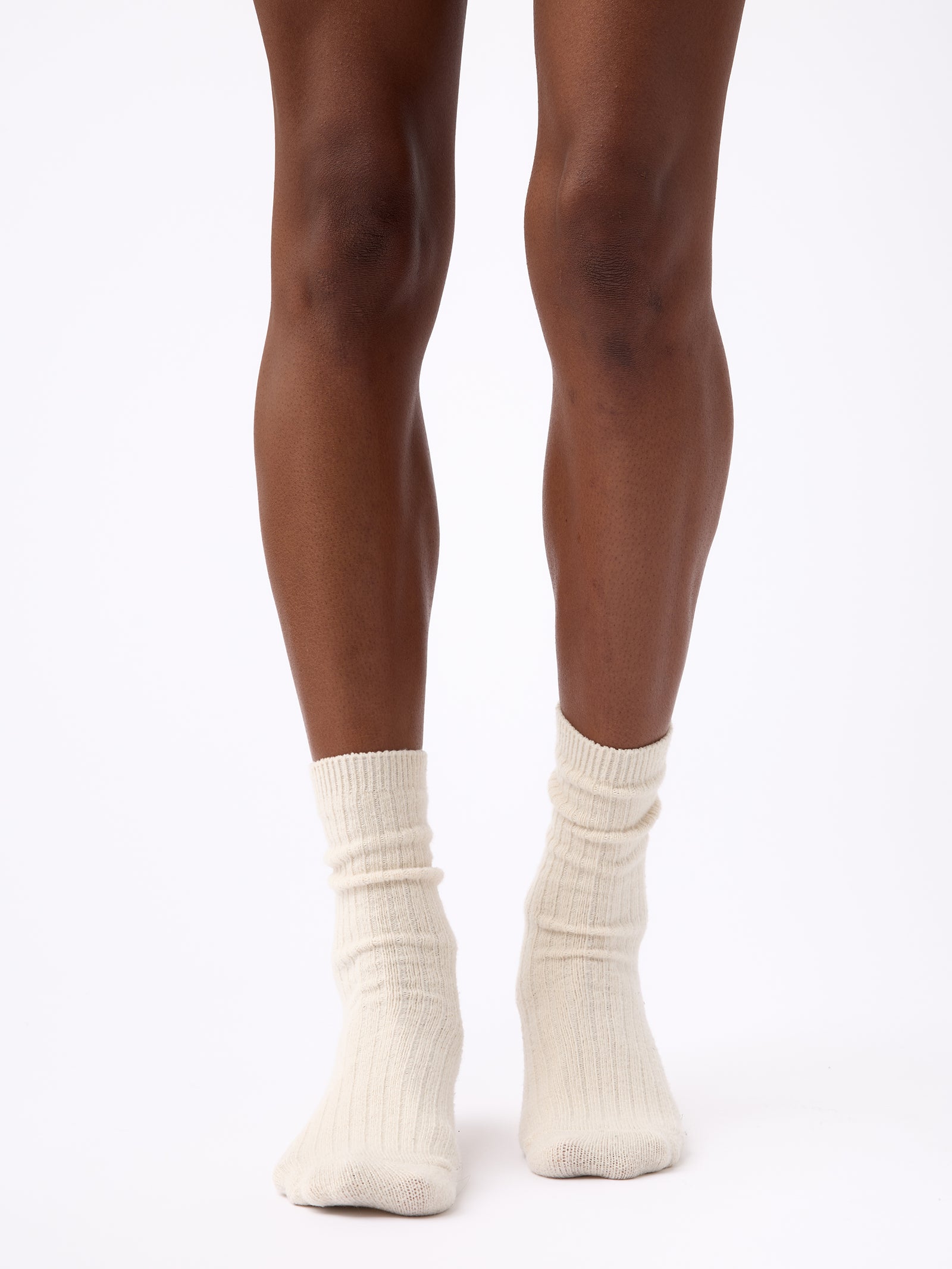 Person wearing Cozy Earth Plush Lounge Sock in Alabaster 
