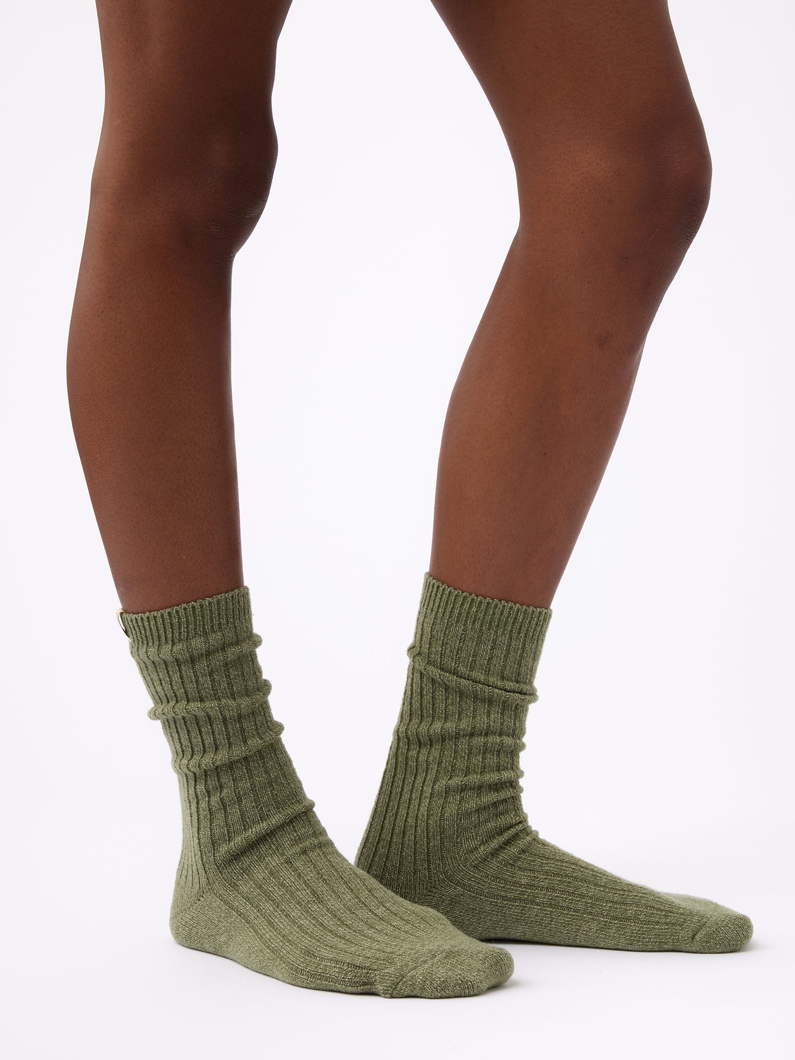 Person wearing Cozy Earth Plush Lounge Sock in Juniper 