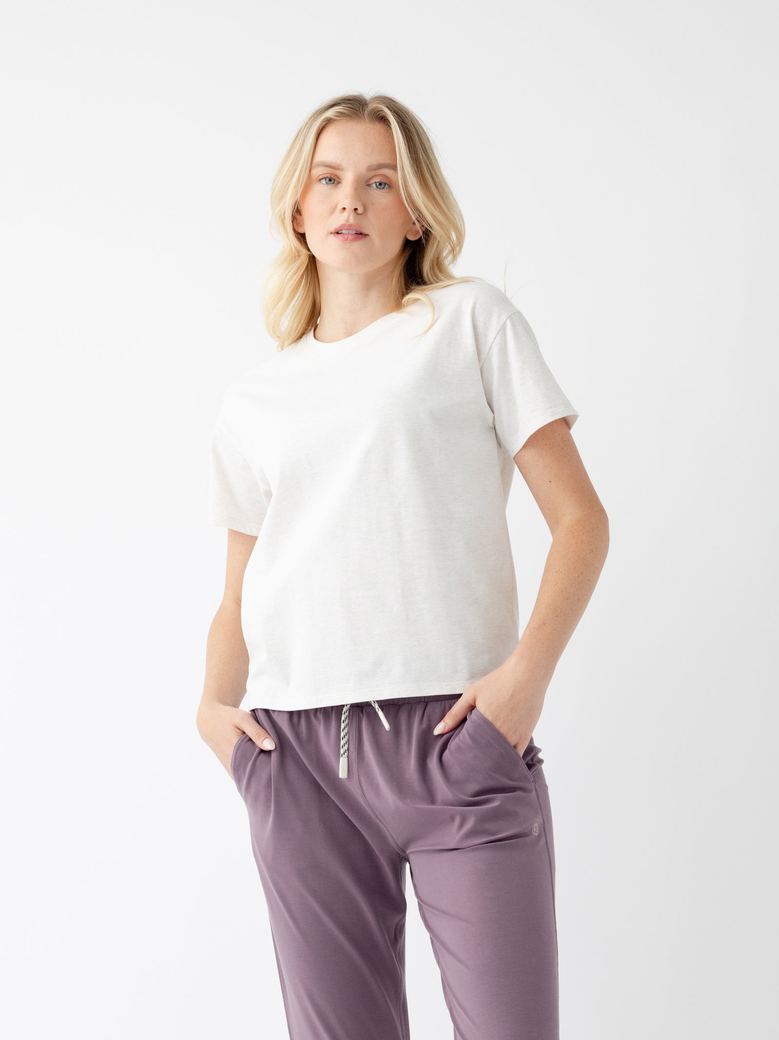 Woman in alabaster tee with white background 