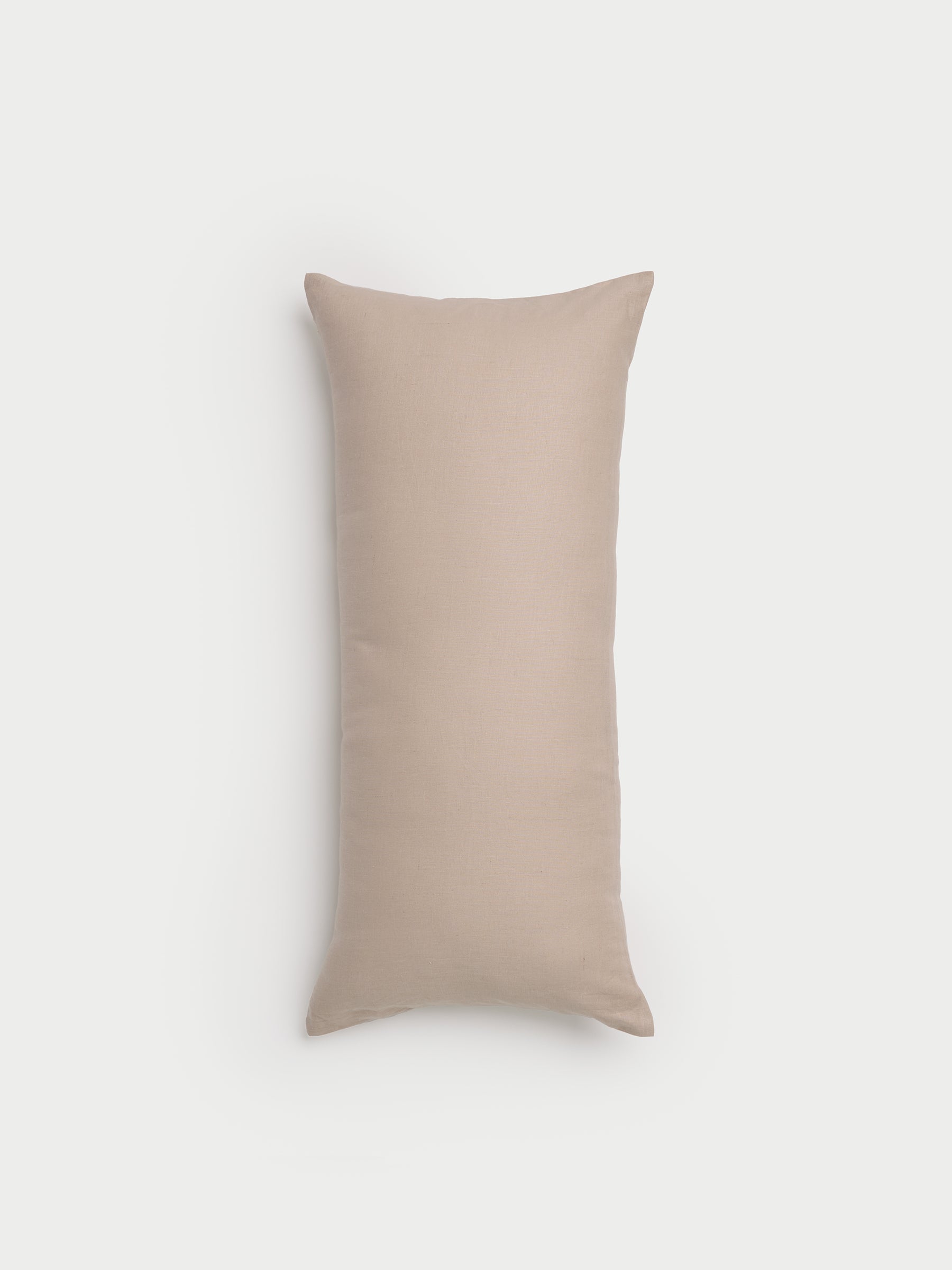 A Linen Throw Pillow by Cozy Earth in a plain, rectangular beige design is set against a light gray background. |Color:Birch|Size:14" x 30"