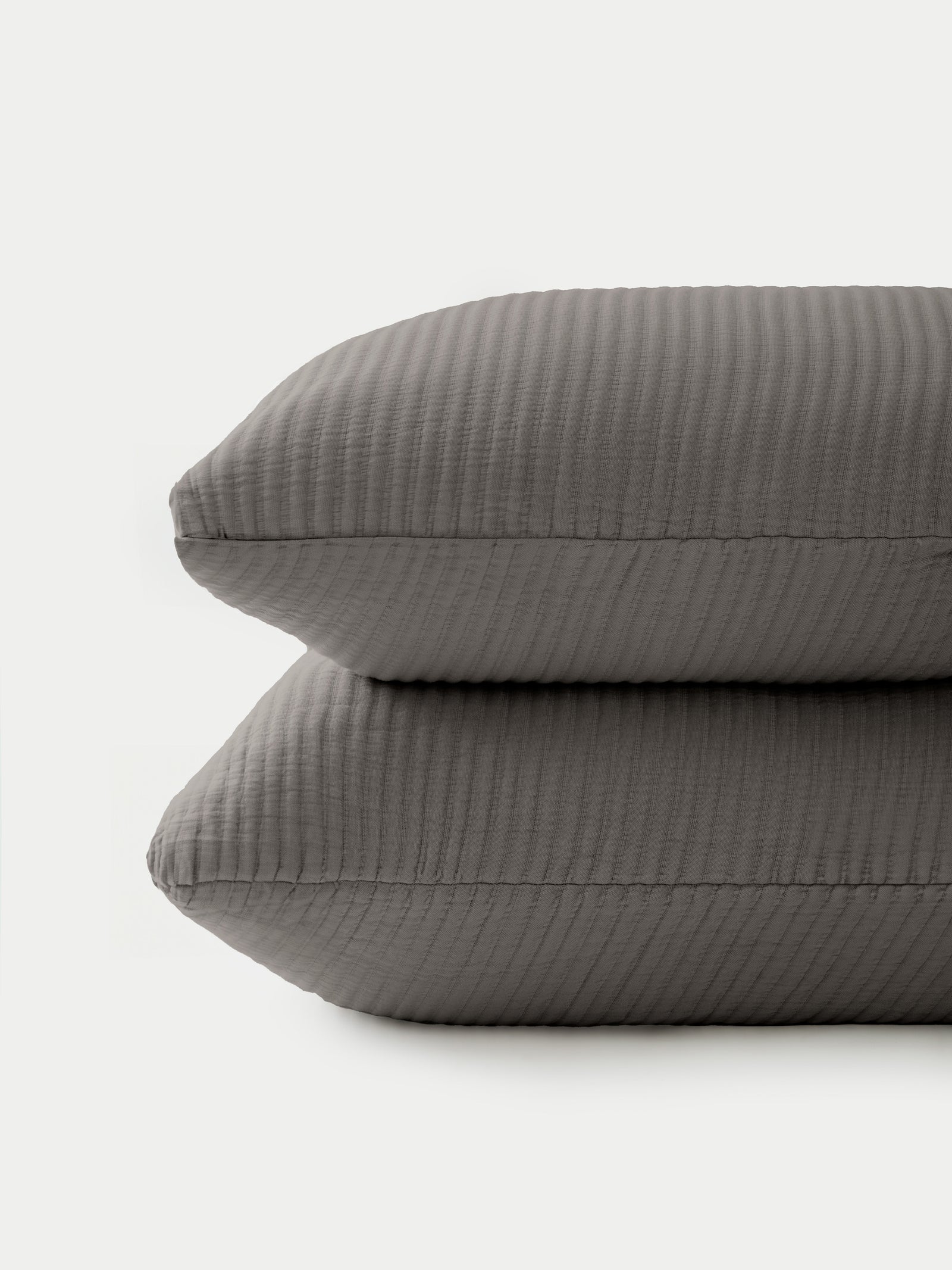 2 charcoal coverlet shams with white background 