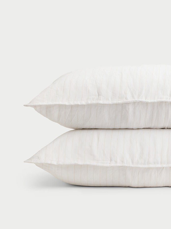 Two flax pencil stripe shams with white background 