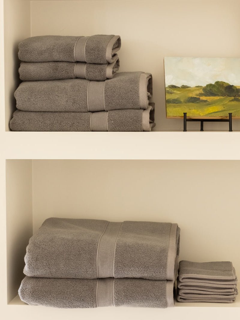 Complete luxe bath bundle folded on shelves 