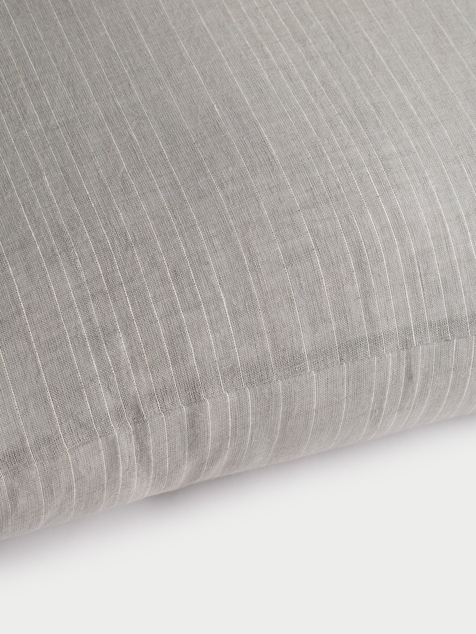 Cozy Earth striped throw pillow with plain white background 