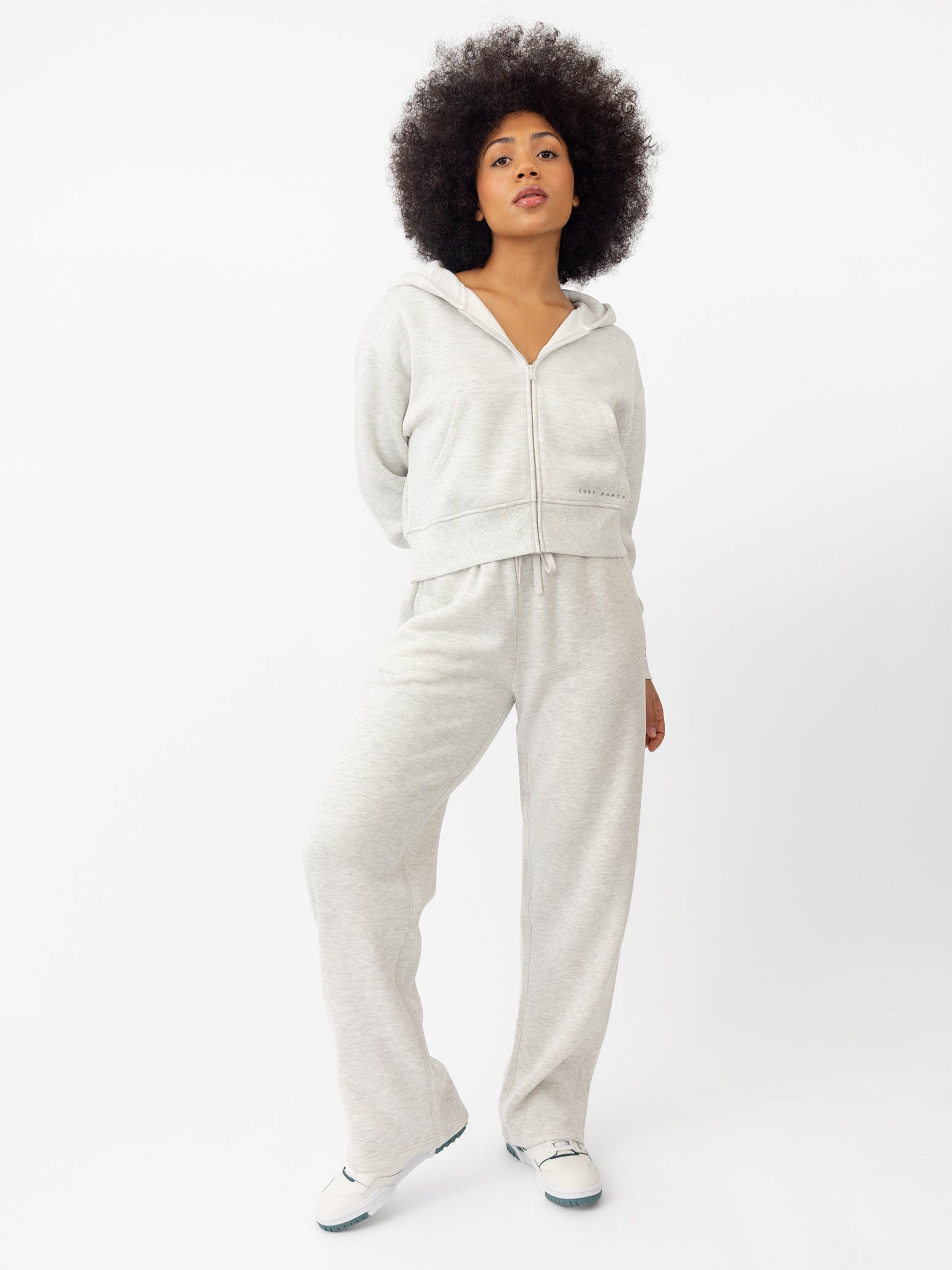 Woman wearing Heather Grey CityScape Cropped Full Zip with white background 