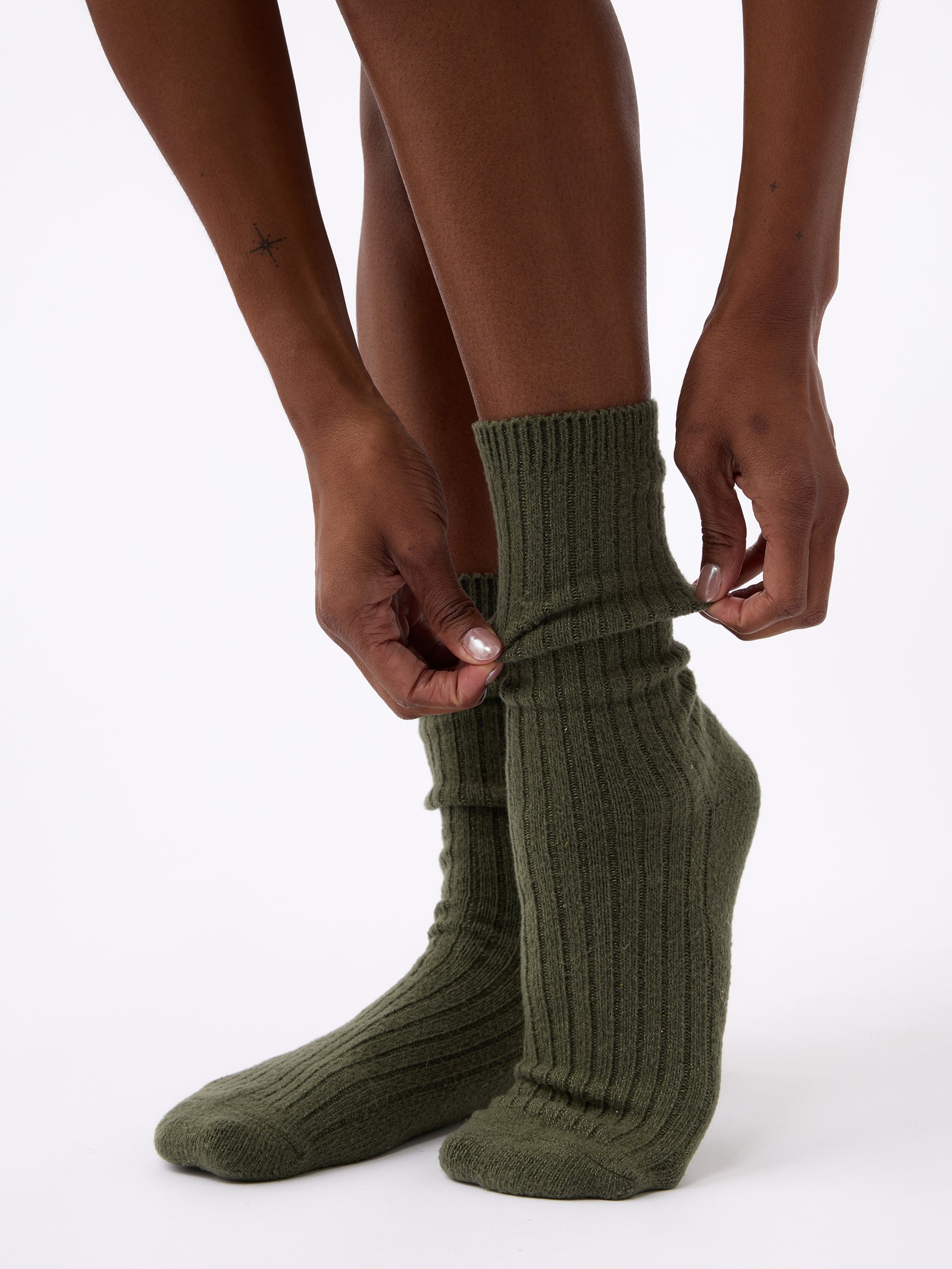Person wearing Cozy Earth Plush Lounge Sock 1-Pack in Olive 