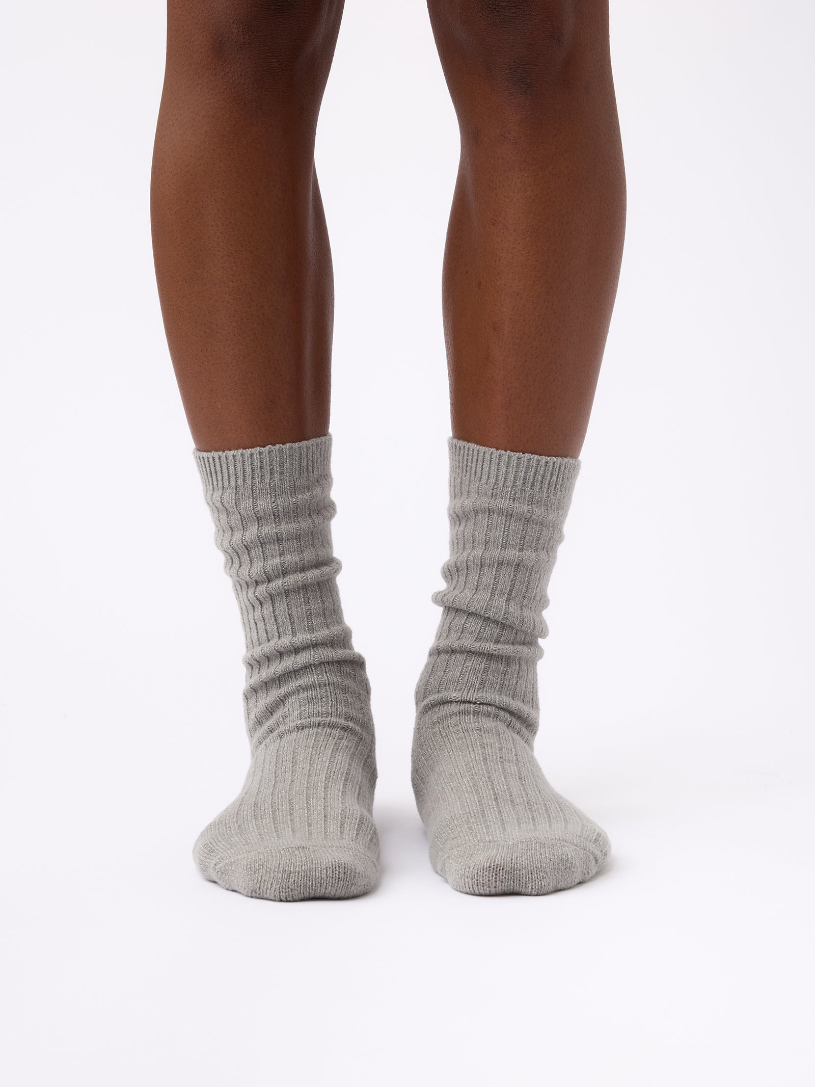 Person wearing Cozy Earth Plush Lounge Sock 1-Pack in Stone 