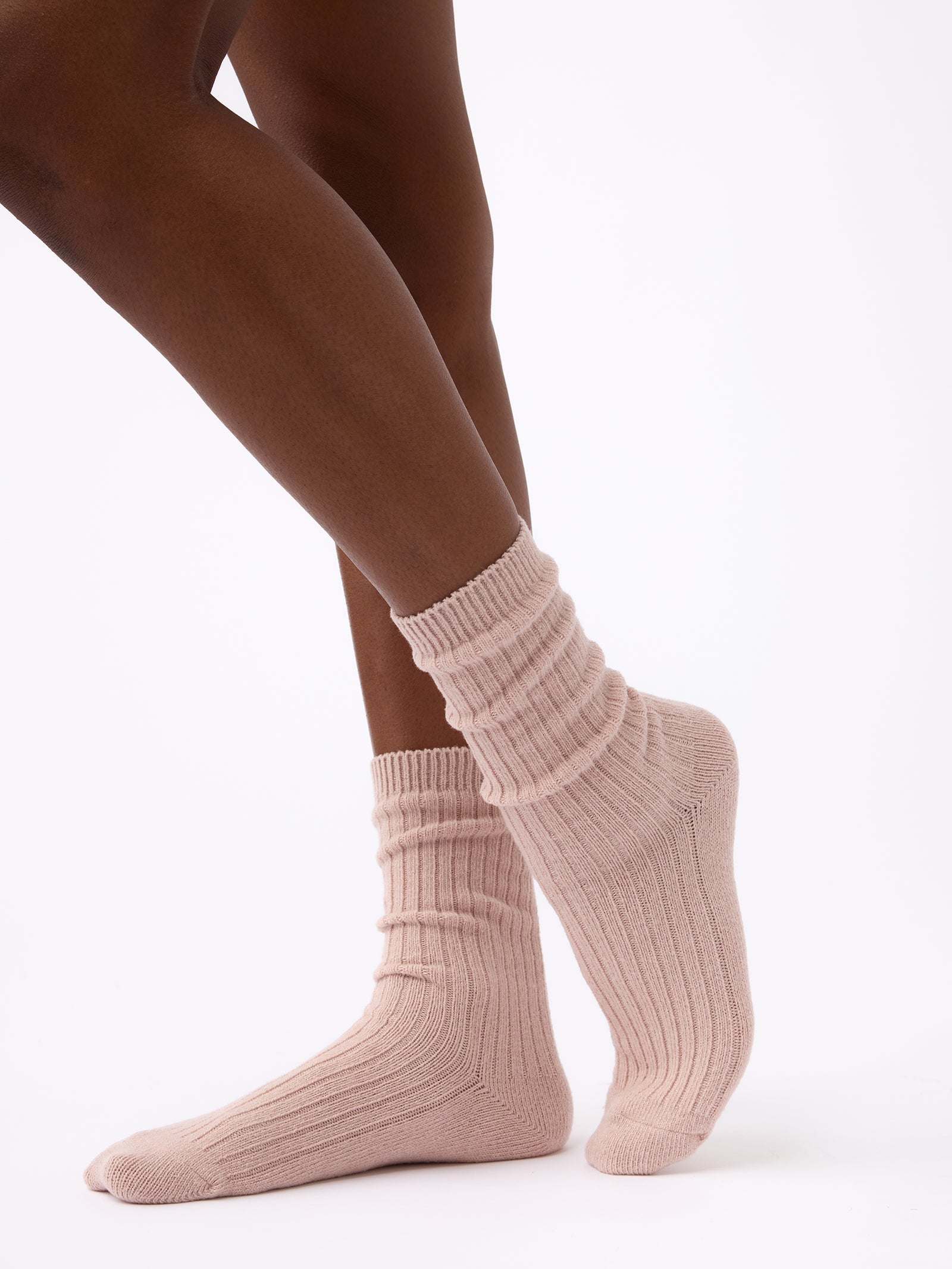 Person turned to the side wearing Cozy Earth Plush Lounge Sock 1-Pack in Dusty Rose 