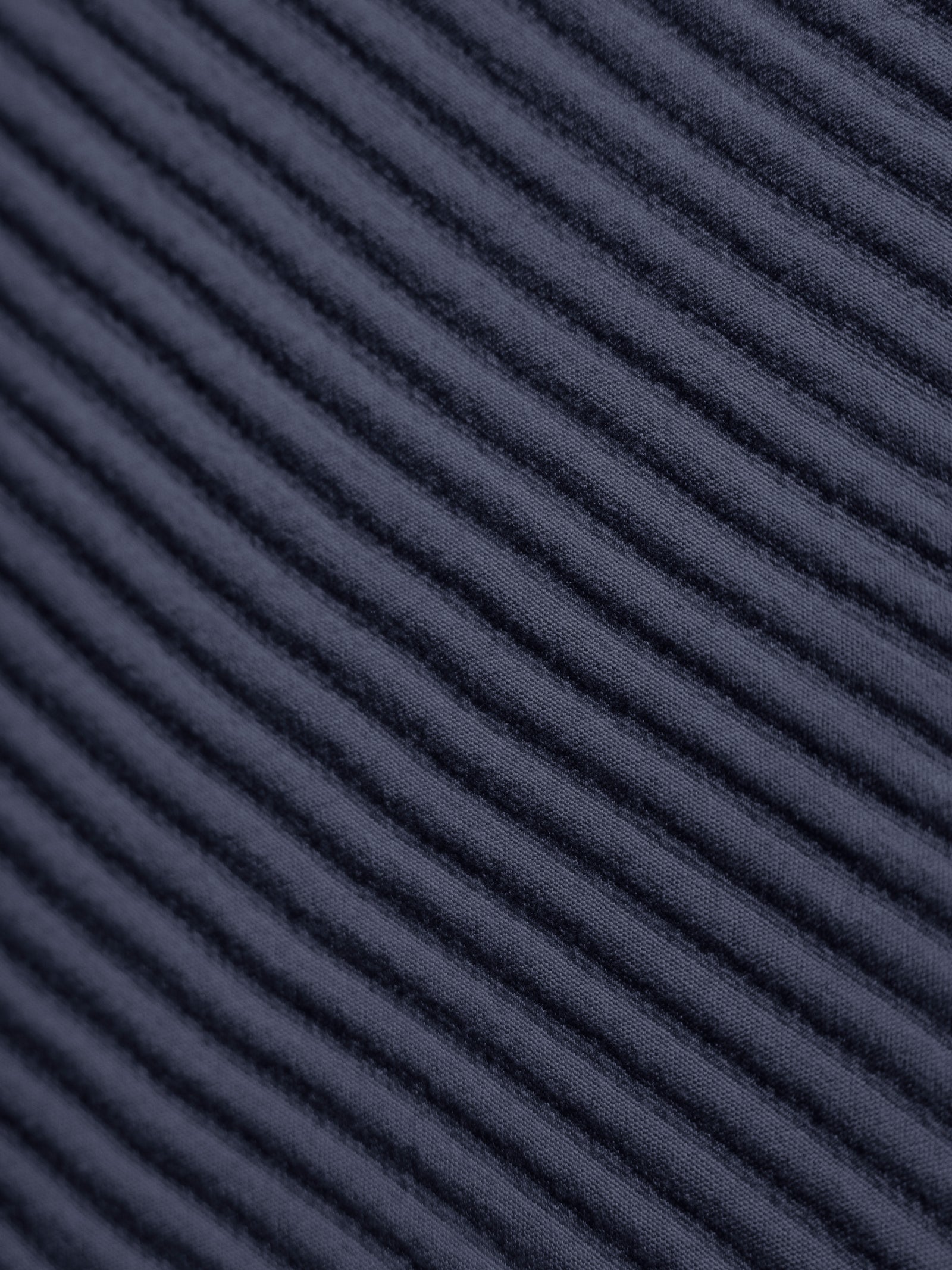 Close up of navy coverlet fabric 