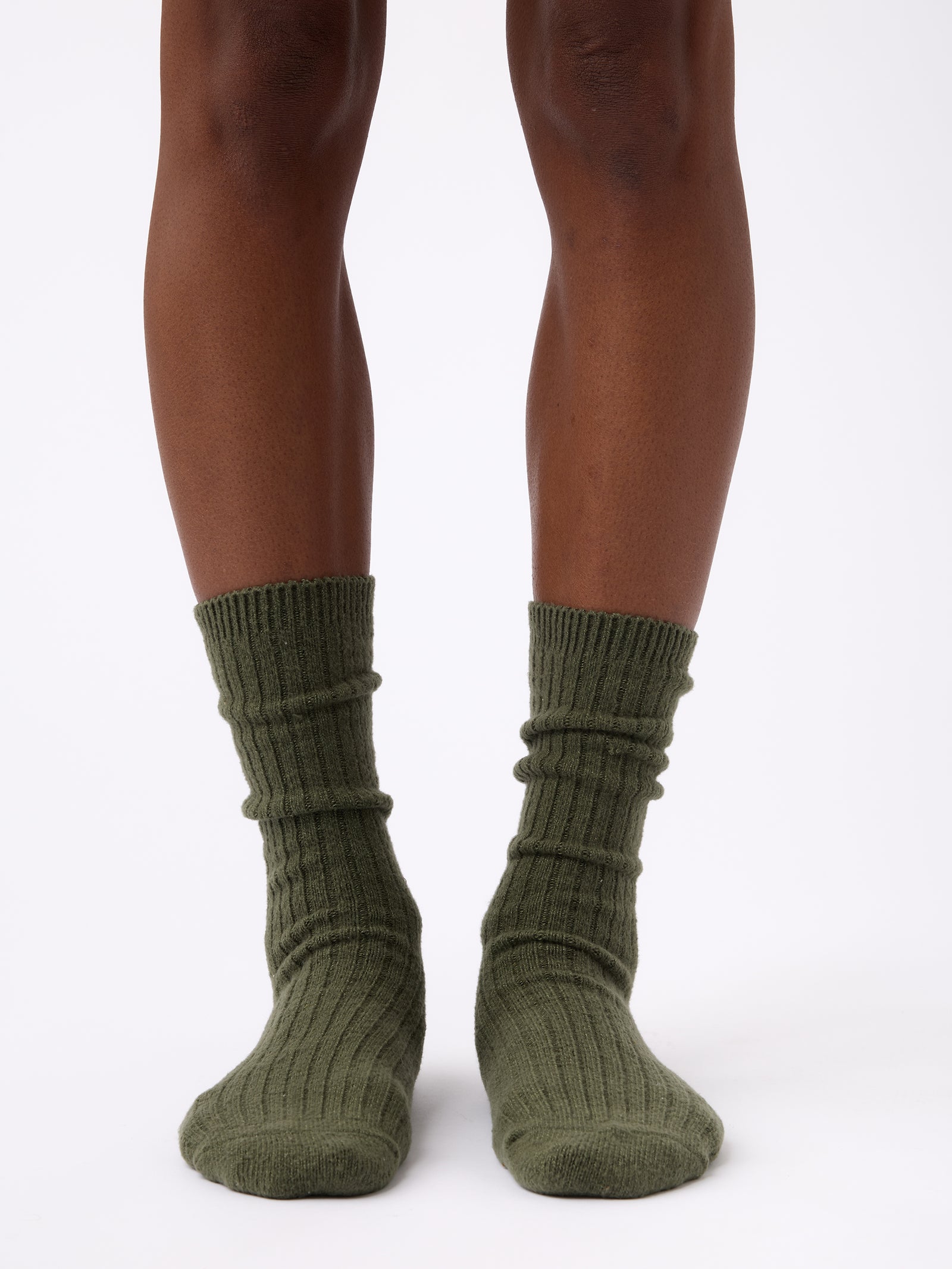 Person wearing Cozy Earth Plush Lounge Sock 1-Pack in Olive 