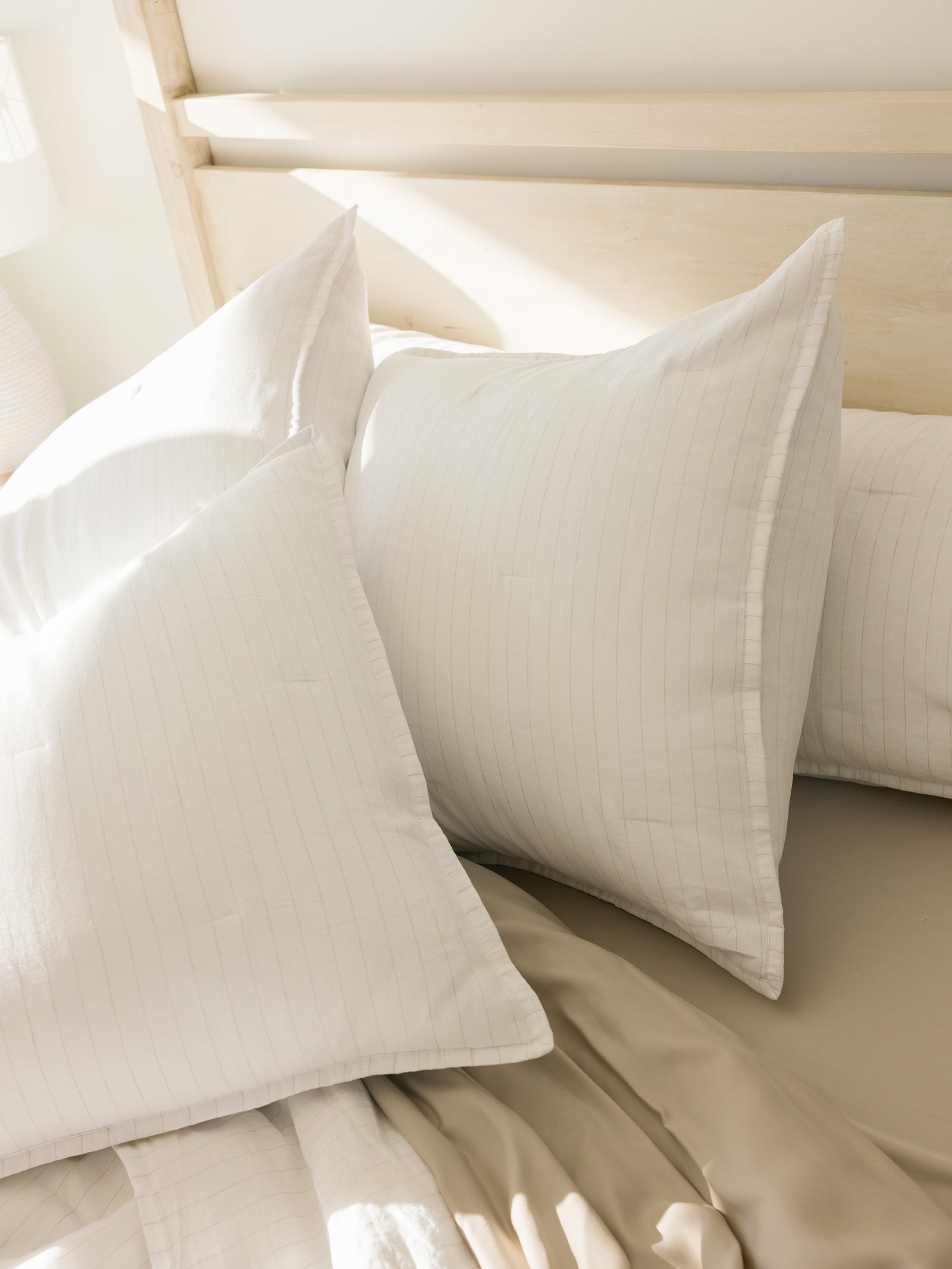 Close up of flax pencil stripe shams 