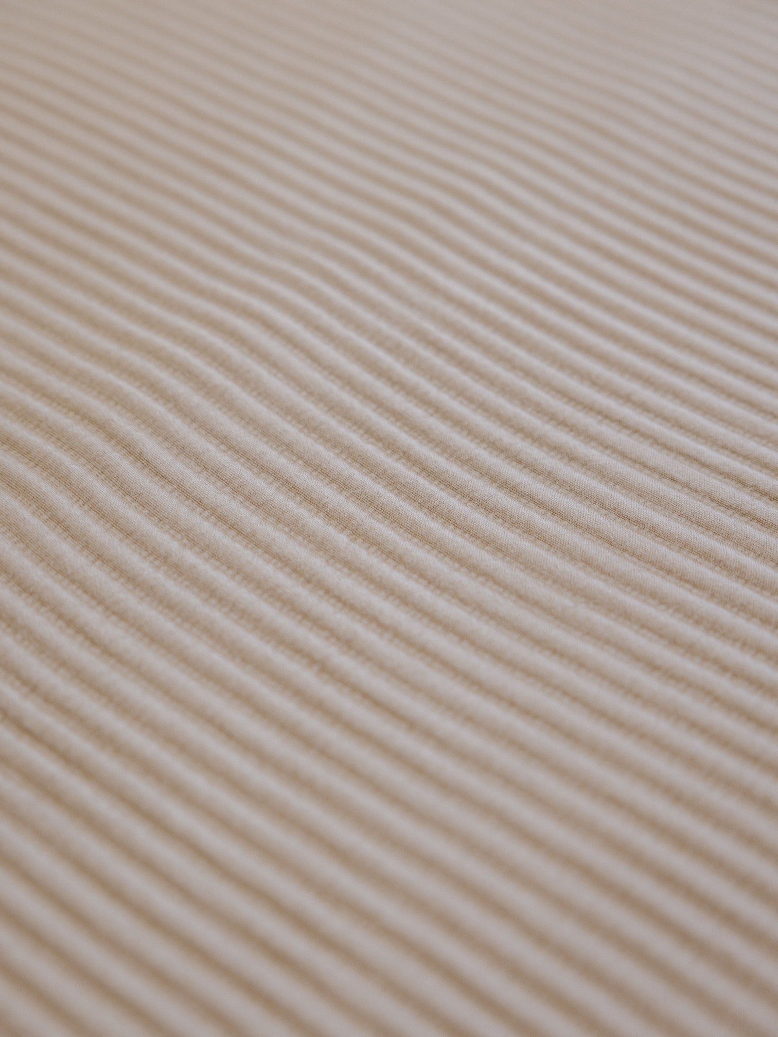 Close up of driftwood coverlet fabric 