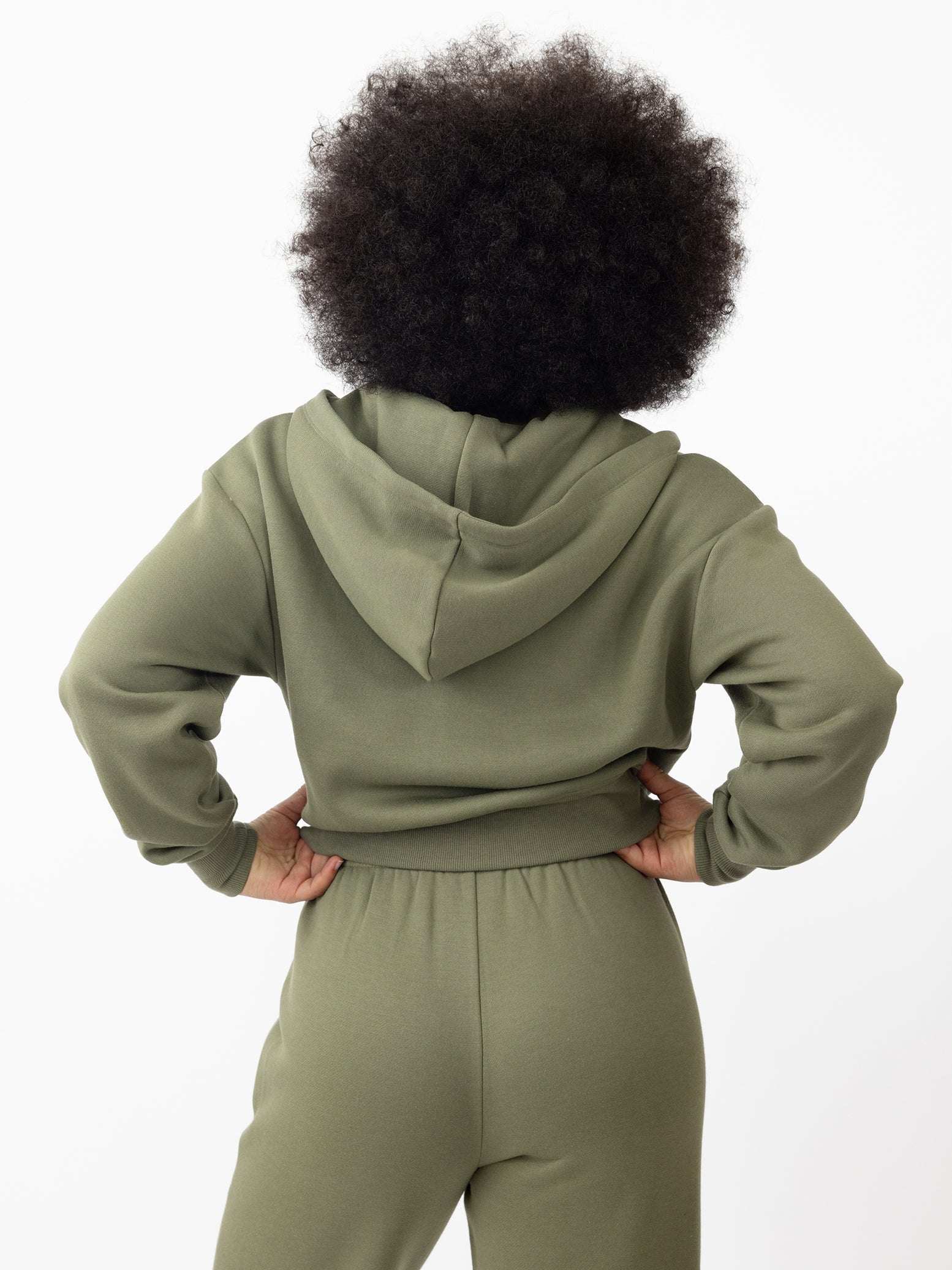Woman wearing Juniper CityScape Cropped Full Zip with white background 