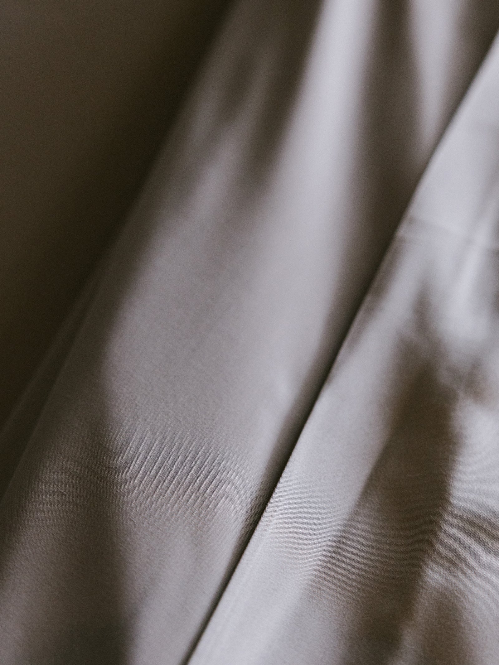 Close up of dove grey bedding 