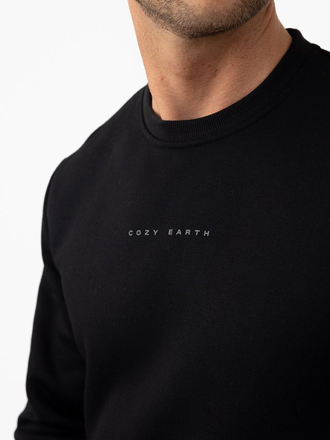 Close up of man wearing black cityscape crewneck 