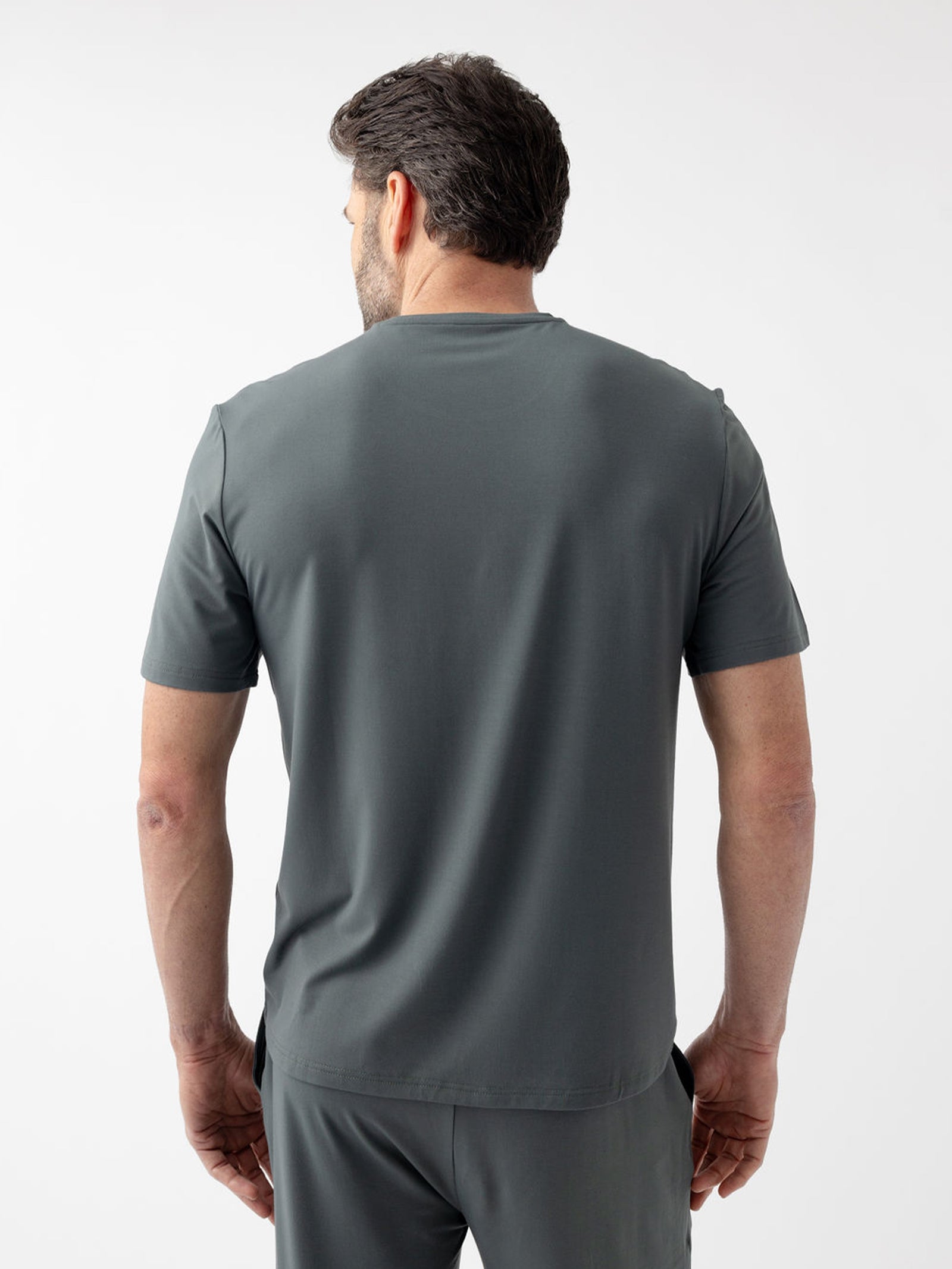 Back of man wearing storm pajama shirt with white background 