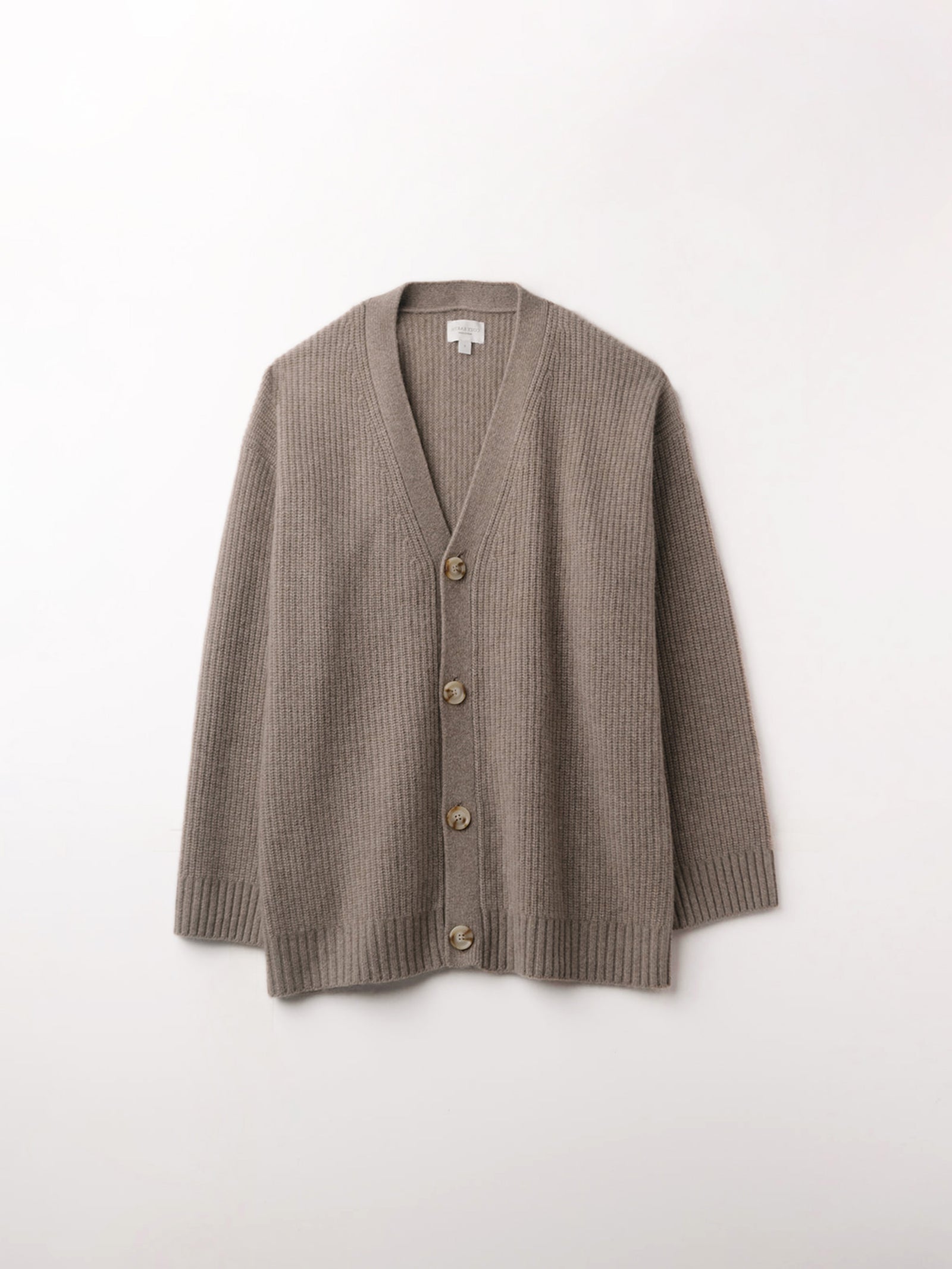 Flat lay of almond sunday cardigan with white background 