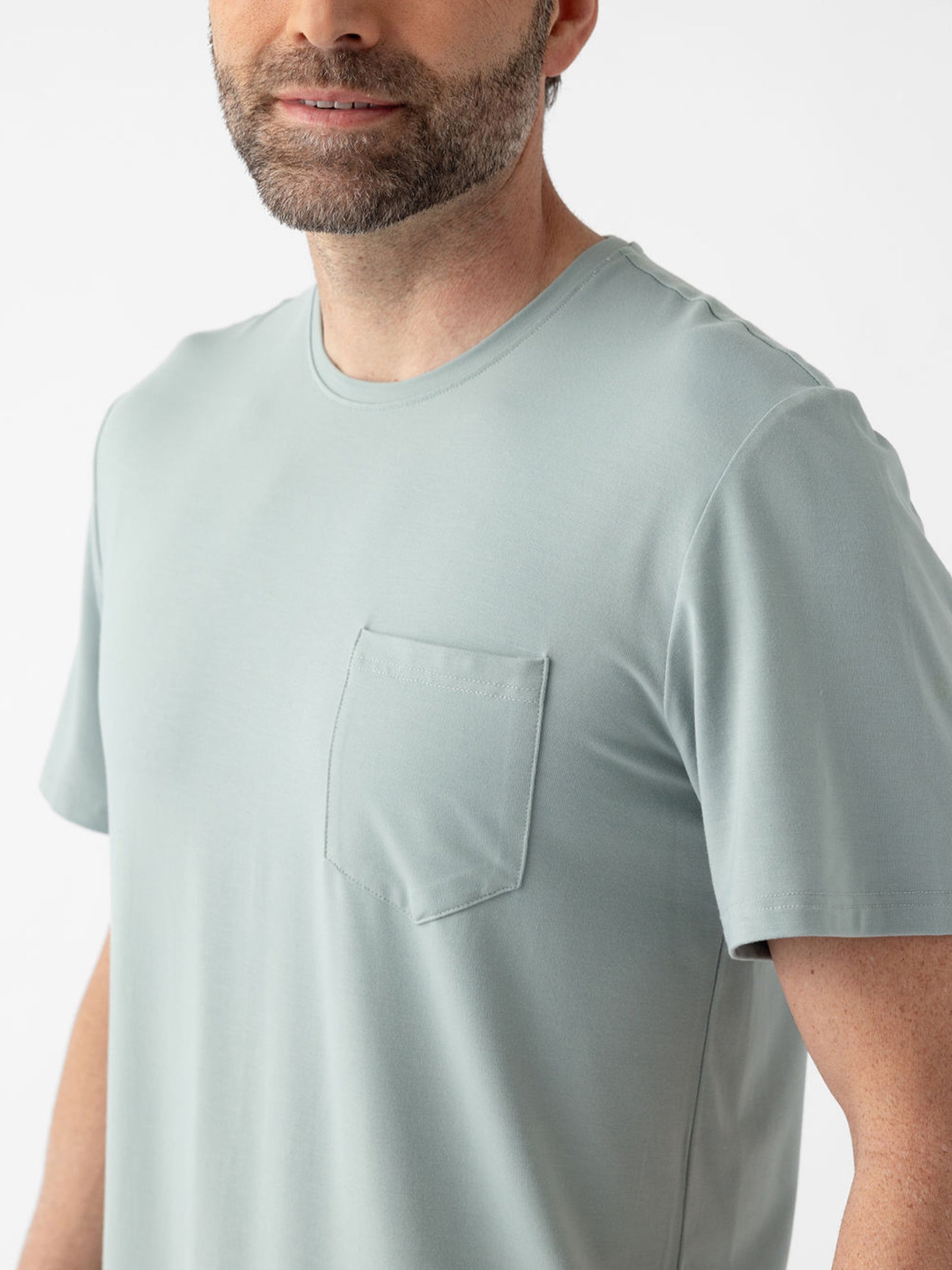 Close up of man wearing haze pajama shirt 