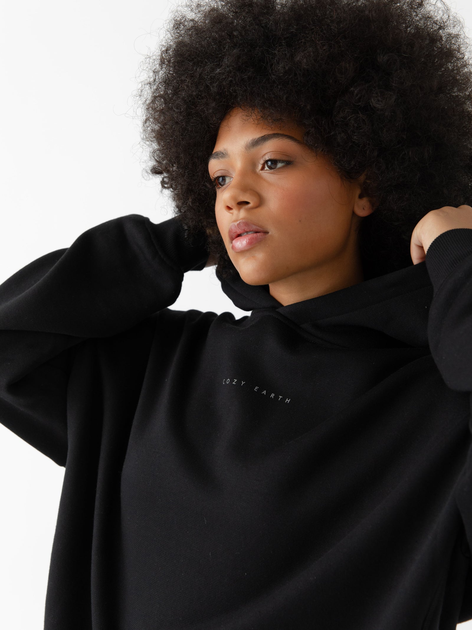 Close up of woman wearing black cityscape hoodie 