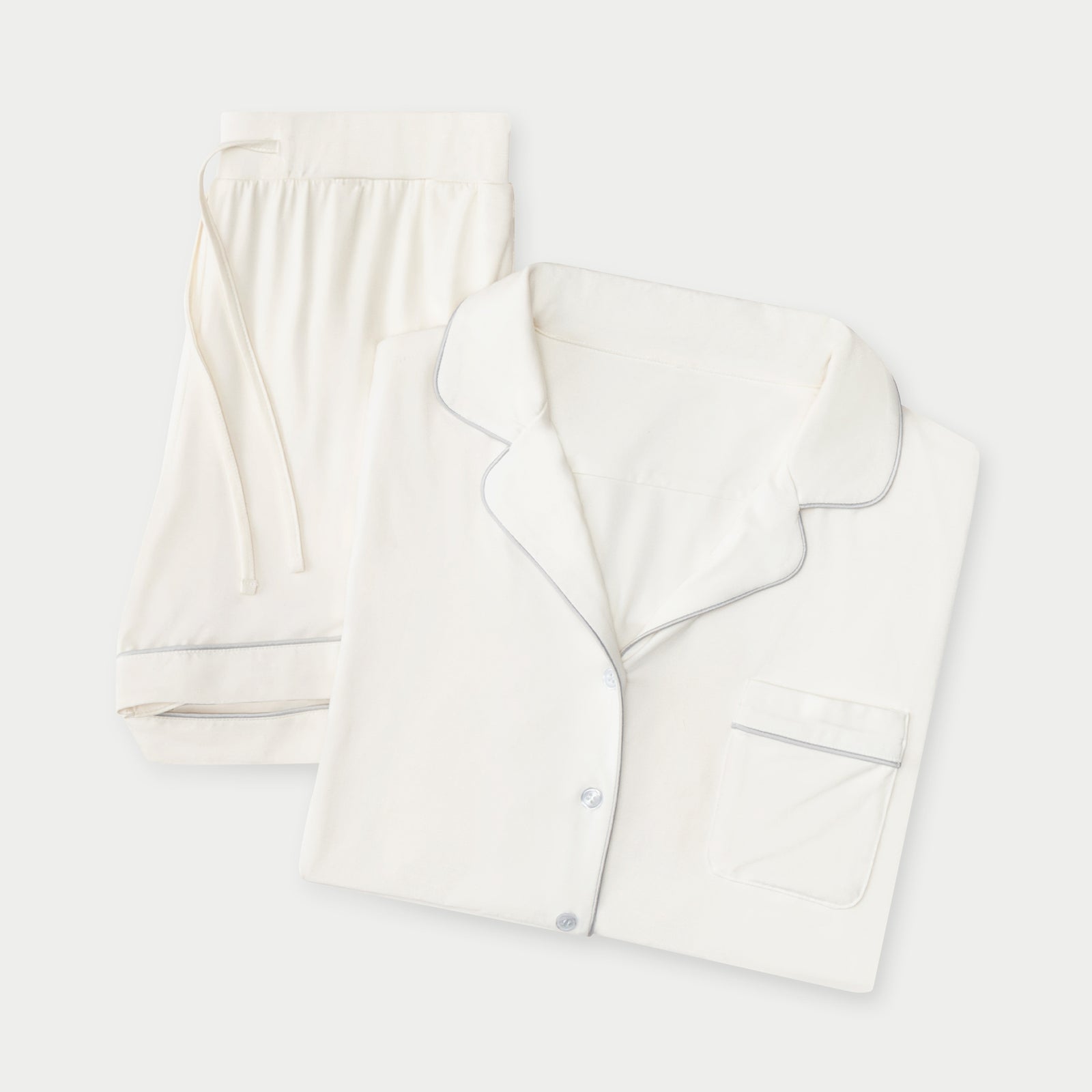 Ivory Short Sleeve Pajama Set. The photo was taken close up, showing off the print of the pajamas. 