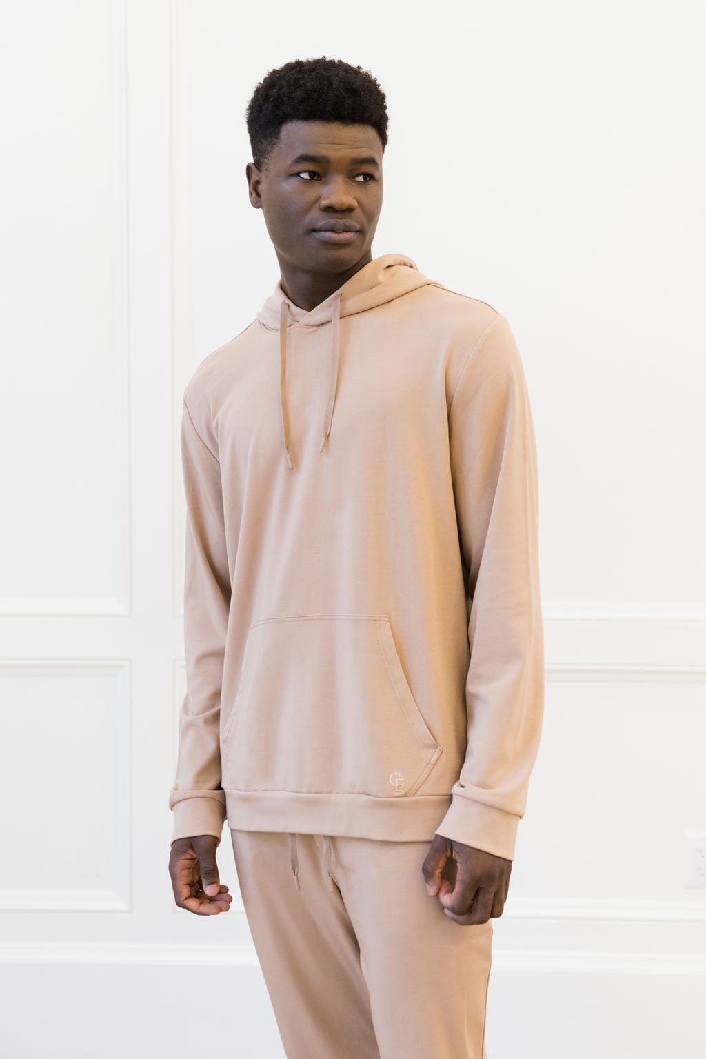TImber Bamboo Hoodie worn by man standing in front of white background.