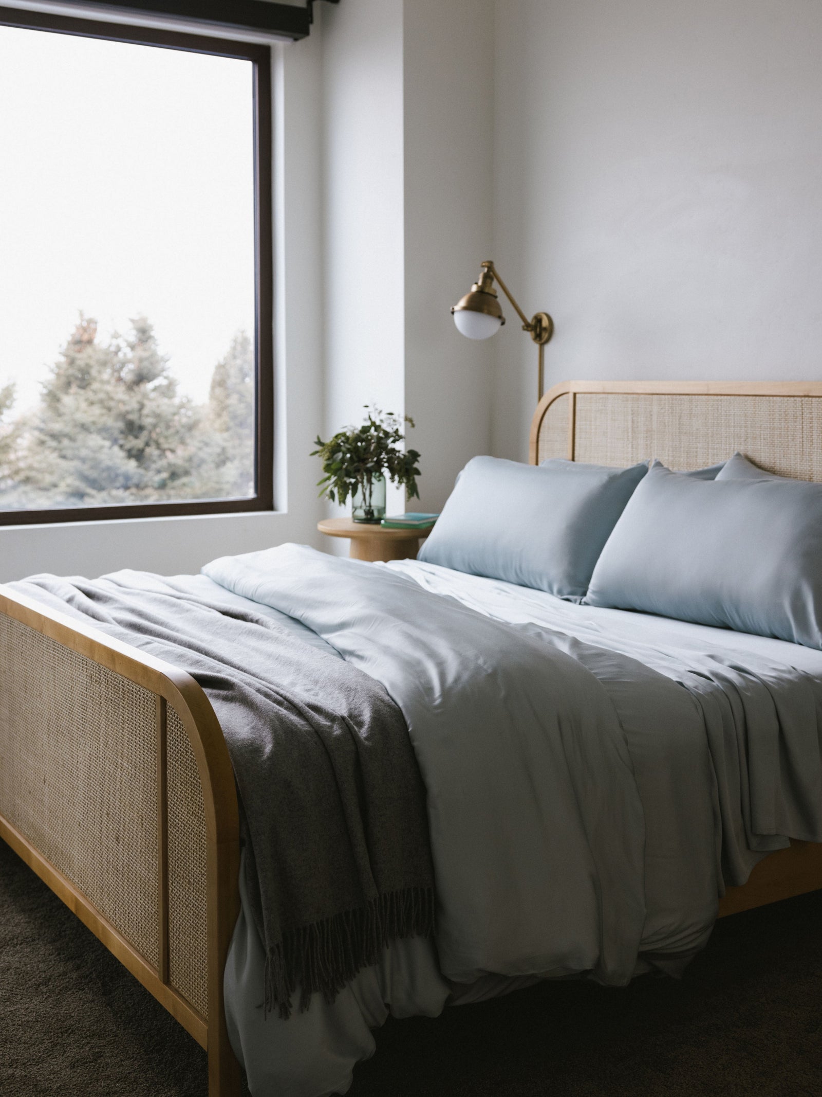 Zoomed out image of bed made with shore bedding 