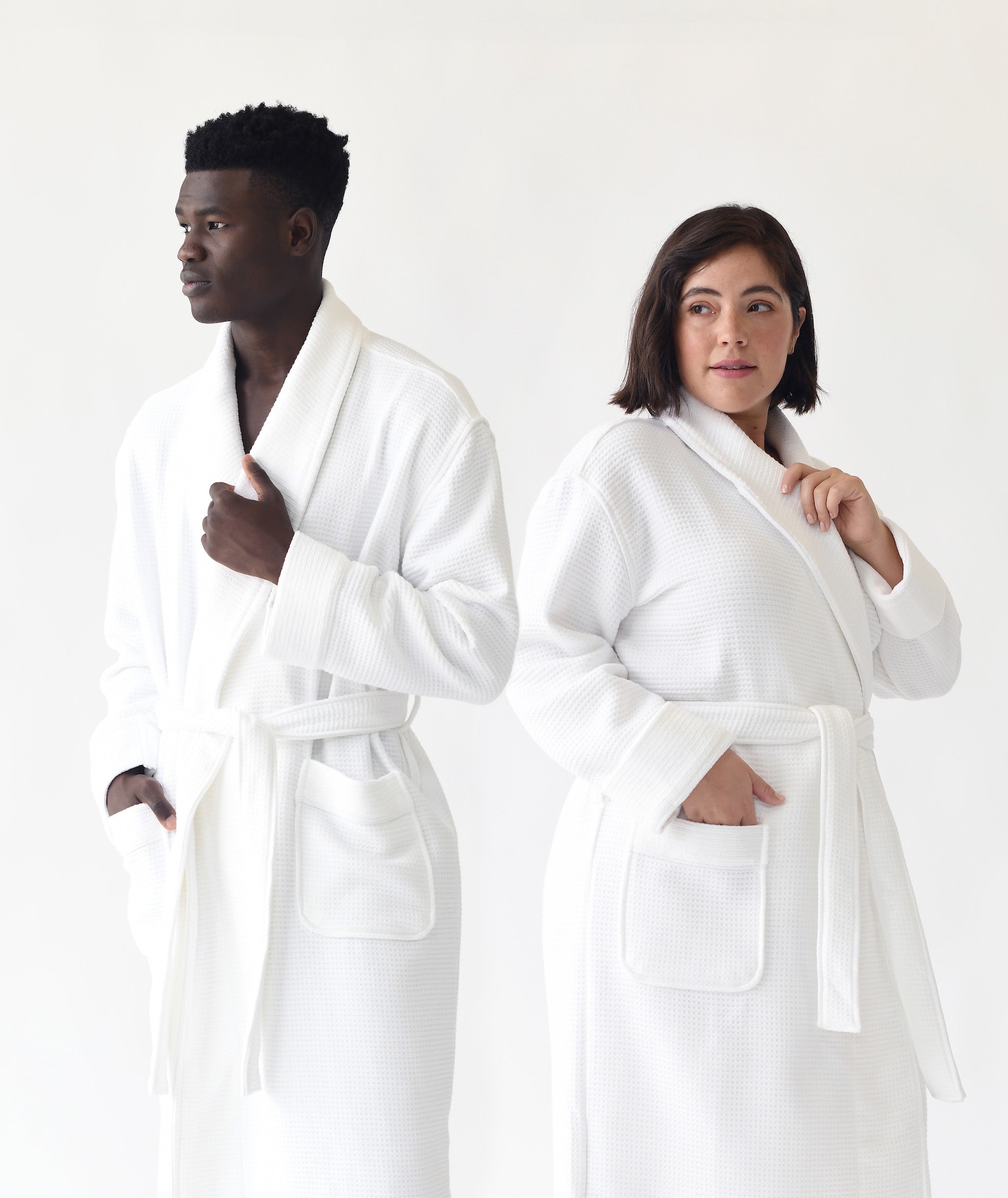  Man and woman standing in front of white background. both the man and the woman are wearing white bamboo waffle knit robes. |Color:White